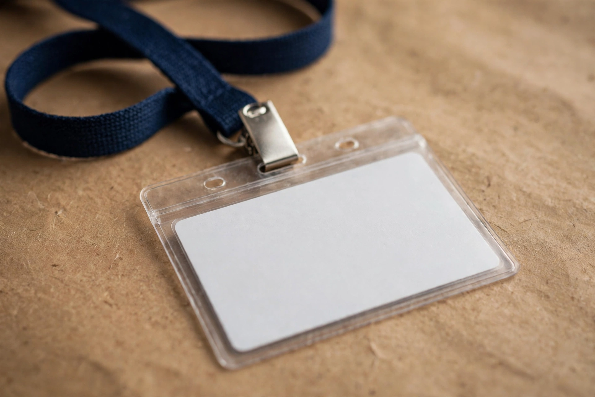 A blank technician ID badge on a navy lanyard, representing R.G. Specialty Development's background-checked technicians
